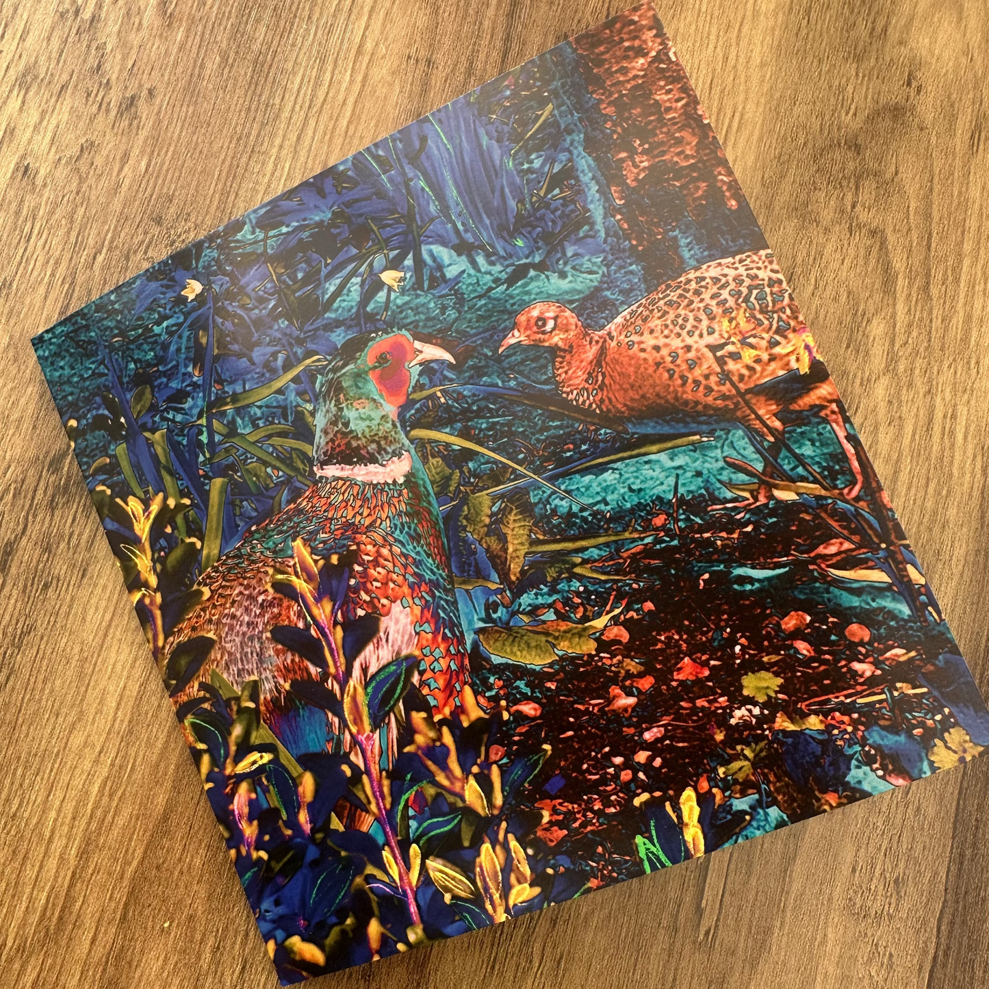 Pheasant card design on a wooden surface