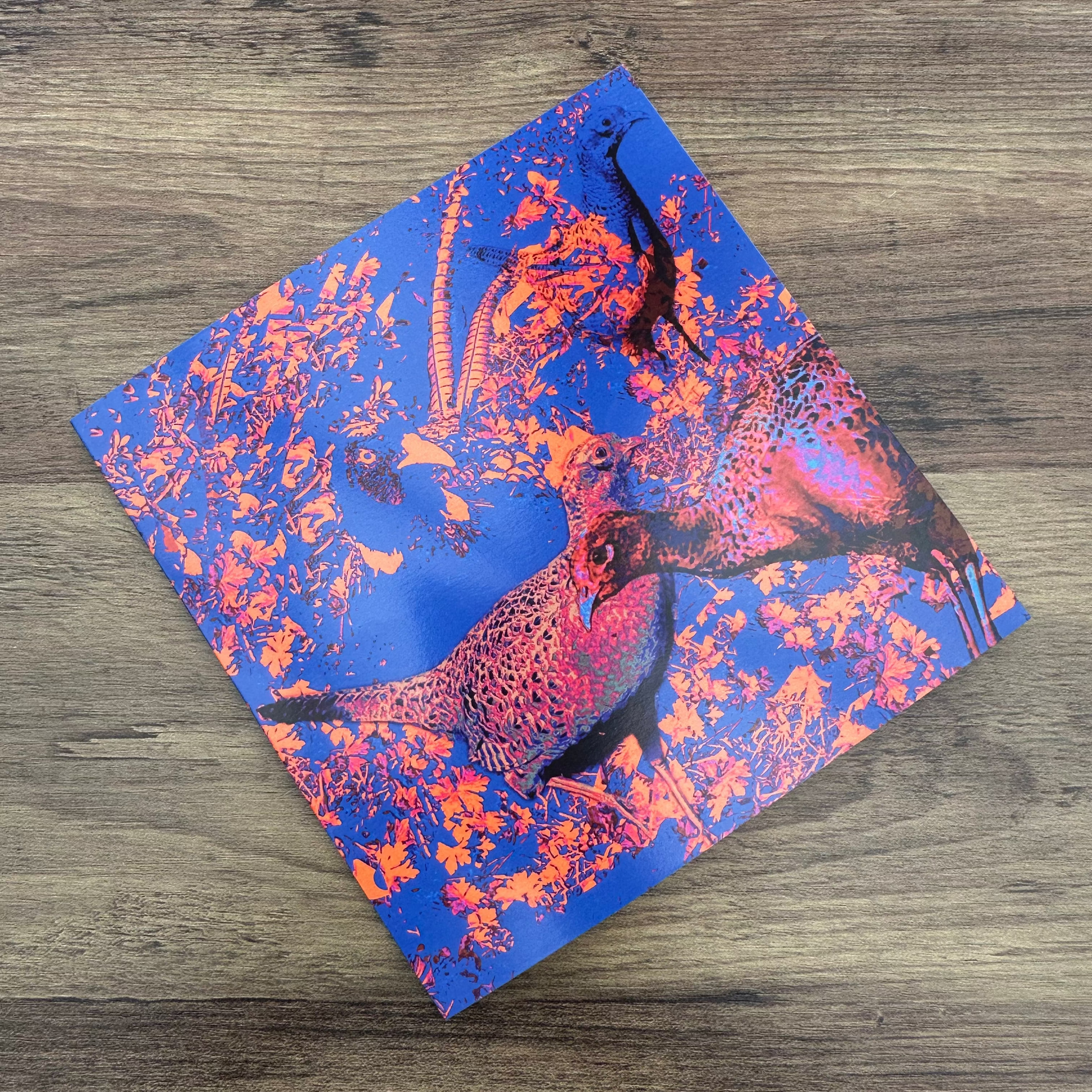 Hen Pheasantts design on a wooden surface